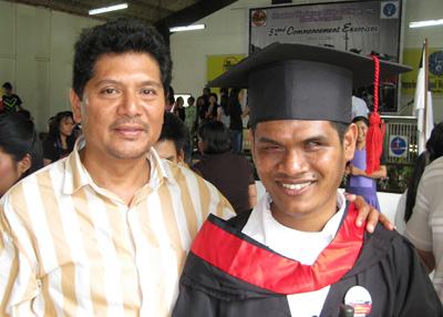 College graduate with his father